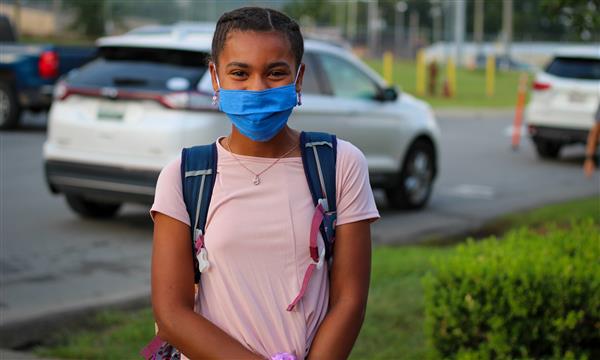 student smiles on first day of school